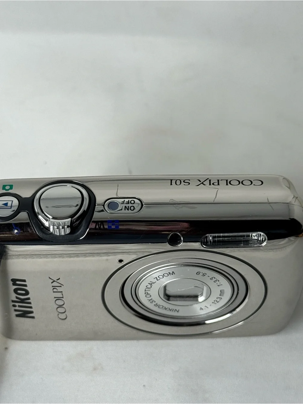 Nikon COOLPIX Silver Point-and-Shoot Camera with Black Case with charger cable